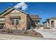 Charming home featuring a stone facade, well-manicured landscaping, and an attached garage at 4051 Happy Hollow Dr, Castle Rock, CO 80104