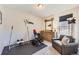 Carpeted gym space with workout equipment, weights, sofa and side table at 4051 Happy Hollow Dr, Castle Rock, CO 80104