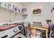 A laundry room featuring a modern washer and dryer set and folding table at 4051 Happy Hollow Dr, Castle Rock, CO 80104