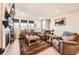 Cozy living room featuring plush furniture, bright windows, and stylish décor at 4051 Happy Hollow Dr, Castle Rock, CO 80104