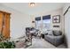 Carpeted office space with a desk, sofa, and large window with blinds at 4051 Happy Hollow Dr, Castle Rock, CO 80104