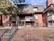 Brick building with multiple units, each with a private deck at 5491 E Warren Ave # 217, Denver, CO 80222