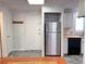 Kitchen with stainless steel appliances and white cabinets at 5491 E Warren Ave # 217, Denver, CO 80222