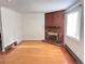 Living room with hardwood floors and brick fireplace at 5491 E Warren Ave # 217, Denver, CO 80222