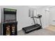 Basement room with arcade machine, treadmill, window and door. Perfect for games and exercise at 4333 E Bennington Ave, Castle Rock, CO 80104
