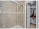 This bathroom has a tiled walk-in shower with a glass door and built-in shelving at 4333 E Bennington Ave, Castle Rock, CO 80104