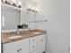 Bathroom features a double sink vanity with a stone countertop and white cabinets at 4333 E Bennington Ave, Castle Rock, CO 80104