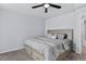 Comfortable bedroom features carpet, gray walls, and a queen bed with built-in storage at 4333 E Bennington Ave, Castle Rock, CO 80104