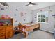 Playful bedroom features gray walls, carpet, natural light, and butterfly decals at 4333 E Bennington Ave, Castle Rock, CO 80104