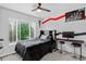 bedroom with neutral colored walls, a window for natural light, and carpeted floor at 4333 E Bennington Ave, Castle Rock, CO 80104