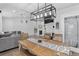 Spacious dining area with modern lighting and convenient access to the kitchen and living room at 4333 E Bennington Ave, Castle Rock, CO 80104
