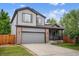 Charming two-story home with gray siding, brick accents, and a two-car garage at 4333 E Bennington Ave, Castle Rock, CO 80104