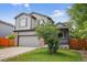 Charming two-story home with gray siding, brick accents, and a well-manicured front yard at 4333 E Bennington Ave, Castle Rock, CO 80104