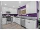 Well-equipped kitchen with stainless steel appliances and white cabinets at 4333 E Bennington Ave, Castle Rock, CO 80104