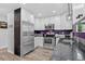 Modern kitchen featuring stainless steel appliances, sleek white cabinetry and a deep sink at 4333 E Bennington Ave, Castle Rock, CO 80104