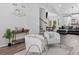 Open-concept living room with hardwood floors, staircase, and stylish decor at 4333 E Bennington Ave, Castle Rock, CO 80104