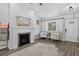 Cozy living room featuring a fireplace, hardwood floors, and ample seating at 4333 E Bennington Ave, Castle Rock, CO 80104