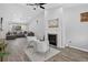 Spacious living room featuring a fireplace, hardwood floors, and a gray sofa at 4333 E Bennington Ave, Castle Rock, CO 80104