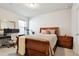 Bright bedroom with double bed, workspace, and ample natural light at 10350 E 57Th Pl, Denver, CO 80238