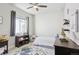 bedroom with dinosaur theme and built-in shelving at 10350 E 57Th Pl, Denver, CO 80238