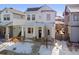 Two-story white house with stone accents and a front porch at 10350 E 57Th Pl, Denver, CO 80238