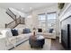 Living room with hardwood floors, two sofas, and a coffee table at 10350 E 57Th Pl, Denver, CO 80238