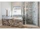 Main bathroom featuring a soaking tub and walk-in shower at 10350 E 57Th Pl, Denver, CO 80238