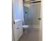 Bathroom with a glass door shower and a white sink with storage below at 16289 E Wagontrail Dr, Aurora, CO 80015