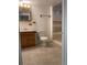 Bathroom featuring wood vanity, tiled shower with glass door and neutral color scheme at 16289 E Wagontrail Dr, Aurora, CO 80015