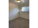 Bedroom with neutral carpet, window with blinds, and white painted walls at 16289 E Wagontrail Dr, Aurora, CO 80015