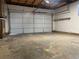 Spacious two-car garage with ample room for storage and a newer garage door at 16289 E Wagontrail Dr, Aurora, CO 80015