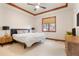 Comfortable bedroom featuring natural light, tray ceiling, and neutral colored accents at 651 Ruby Trust Dr, Castle Rock, CO 80108