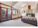 Comfortable bedroom with a private balcony and decorative lighting at 651 Ruby Trust Dr, Castle Rock, CO 80108