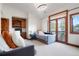 Cozy bedroom with built-in desk area and access to a private balcony at 651 Ruby Trust Dr, Castle Rock, CO 80108