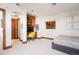 Spacious bedroom with built-in desk, shelving, and modern decor and bed at 651 Ruby Trust Dr, Castle Rock, CO 80108