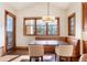 Bright dining room with a banquette and large windows at 651 Ruby Trust Dr, Castle Rock, CO 80108