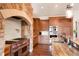 Gourmet kitchen features a stone arch over a high-end range and granite counters at 651 Ruby Trust Dr, Castle Rock, CO 80108