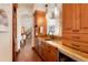 Kitchenette with wood cabinets, stainless steel appliances, and granite countertops at 651 Ruby Trust Dr, Castle Rock, CO 80108
