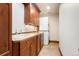 Convenient laundry area with washer, dryer, cabinetry, folding counter space, and tile flooring at 651 Ruby Trust Dr, Castle Rock, CO 80108