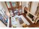 Bright living room with stone fireplace, high ceilings, and a unique antler chandelier at 651 Ruby Trust Dr, Castle Rock, CO 80108