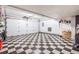 Spacious garage with checkerboard floor at 2314 S Troy St, Aurora, CO 80014