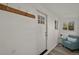 Bright entryway featuring a modern front door, coat rack, and stylish flooring at 2461 Depew St, Edgewater, CO 80214