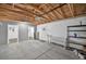 The open garage has high ceilings, exposed rafters, a back entrance and is ready for customization at 2461 Depew St, Edgewater, CO 80214