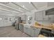Bright kitchen featuring gray cabinets, subway tile backsplash, butcher block counters and stainless steel appliances at 2461 Depew St, Edgewater, CO 80214