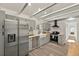 Modern kitchen featuring stainless steel appliances, light gray cabinets, and butcher block counters at 2461 Depew St, Edgewater, CO 80214