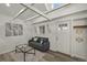 Cozy living room with modern decor, exposed beams, and hardwood floors at 2461 Depew St, Edgewater, CO 80214