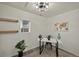 Bright office space with neutral paint, modern desk, decorative light fixture and shelving at 2461 Depew St, Edgewater, CO 80214