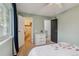 Bright bedroom featuring a closet, dresser, ceiling fan and ample natural light from the window at 9195 E Lehigh Ave # 162, Denver, CO 80237