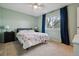 Comfortable bedroom with a ceiling fan, window, and carpeted floors, creating a relaxing atmosphere at 9195 E Lehigh Ave # 162, Denver, CO 80237