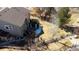Aerial view of the backyard showcasing privacy fence, pergola covered hot tub, and landscaping at 4765 Larksong Dr, Castle Rock, CO 80109